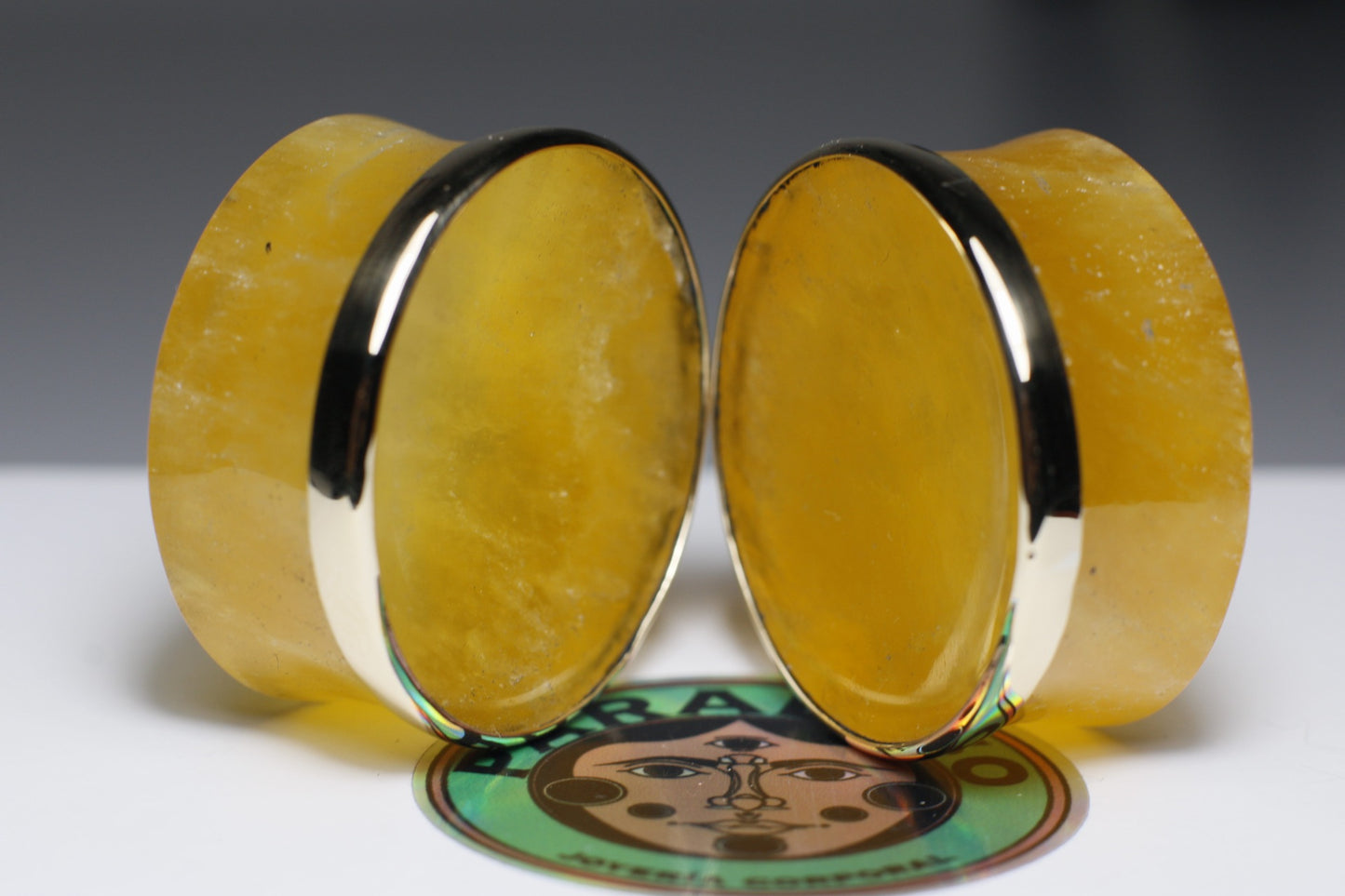 Plugs de calcita naranja con bizel dorado  - Mandar a fabricar